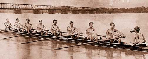 The Detroit Boat Club was quick to adopt the sleek new racing sculls developed around the turn of the century. This 1904 team helped keep the club a major force in rowing. The old Belle Isle Bridge can be seen in the background. 
