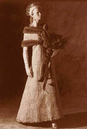 This Ruth Joyce design was worn by Pam Eldred, Miss America 1970, in that year's Miss America parade. It's a pink silk brocade gown with matching stole.