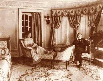 Mr. and Mrs. William Muir Finck in a parlor of their Van Dyke mansion. Finck made his fortune from blue jeans.