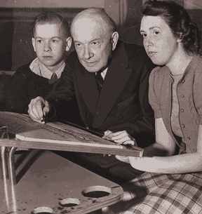 After filing for bankruptcy in 1936, Durant tried the bowling business, opening an alley in Flint in 1940. Here he poses with customers at a scoring table in 1941.