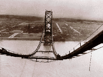 A view down the suspension cables toward Sandwich, Ontario, during construction of the Ambassador Bridge in 1929.