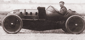 Louis Chevrolet behind the wheel of a Buick Special in his first appearance at Indianapolis in 1910, before the raceway had been paved with brick. 