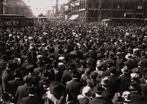 The crowd watched in silence as Gardiner began his climb on the first pillar from the corner on the facade of the Central Savings Bank.