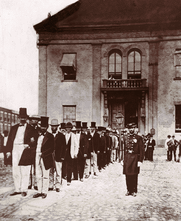 Looking properly impressed by the dignity of the occasion, Detroit city fathers pose in front of the REALLY old city hall in 1872 on the day of their move into what we now call Old City Hall.
