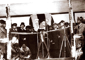 Michigan Gov. Fred W. Green, standing behind the microphone at right, waits to deilver his eloquent oration to the bridge.