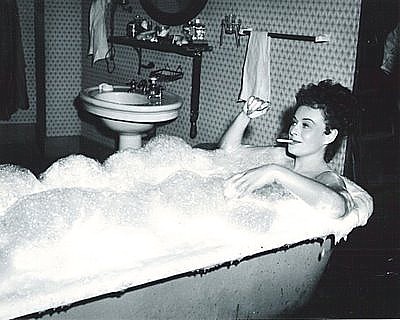PAULETTE GODDARD in her bath tub scene from "Anna Lucasta." Rapper described Goddard as "a courtesan."