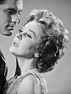 SUSAN HAYWARD (above right) snak her teeth into the melodrama of &quot;Back Street,&quot; with co-star John Gavin.