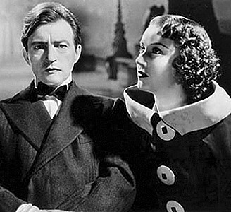 CLAUDE RAINS with Fay Wray in &quot;The Clairvoyan,.&quot; filmed during her days working in England.