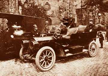 This could be the city's first police car. While there is nothing on the back of the photo that identifies it as such, it appears to be a Packard from around 1909 or 1910, the vintage purchased for the department by Frank Croul. The officer standing in the backseat is identified as Burton Girardin, grandfather of Ray Girardin who was police commissioner in the 1960s.