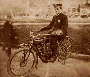 A Detroit police officer in 1910 on a Detroit Police Department motorcycle. Detroit's department was an early pioneer in motorization. 
