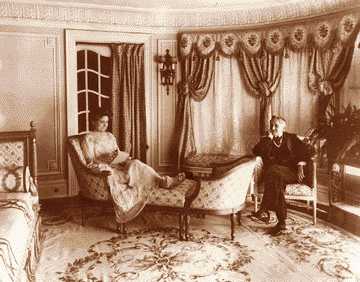 Mr. and Mrs. William Muir Finck in a parlor of their Van Dyke mansion. Finck made his fortune from blue jeans. 