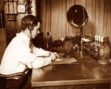 Police radio operator B.D. Fitzgerald at the controls of the radio dispatch equipment at Detroit Police headquarters in 1925. 