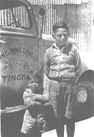 John Pratt and friend in front of a Wing Hing Long delivery truck, about 1950.